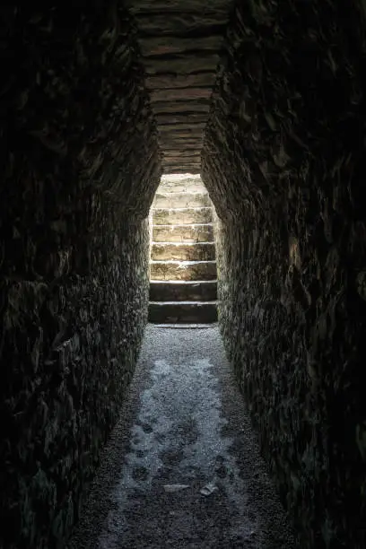 Photo of Dark tomb tunnel in the palace at the archealogical site of Palenque, Chiapas, Mexico