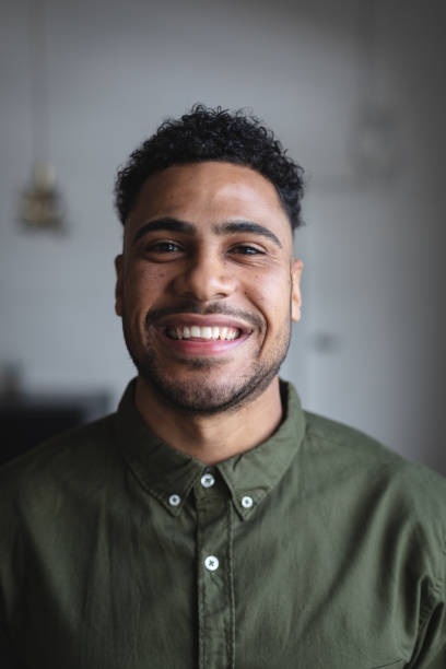 istock Portrait of middle eastern man smiling against grey background 1289197279