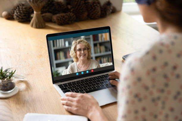 istock Woman speak on video call with teacher 1289197489