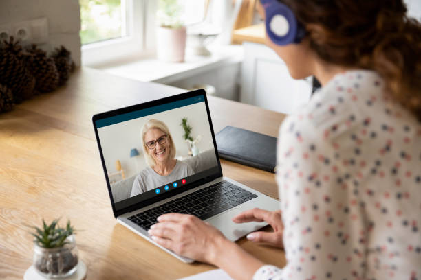 istock Woman talk on video call on laptop with elderly mom 1289197507
