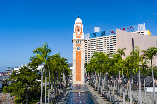 Hong Kong - November 22 2020 : Hong Kong Clock Tower, Former Kowloon-Canton Railway Clock Tower in Tsim Sha Tsui, Eye Level View.\n\nThe Clock Tower is a landmark in Hong Kong. It is located on the southern shore of Tsim Sha Tsui, Kowloon.