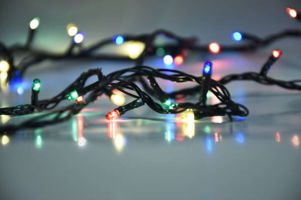 istock Christmas lights on the dark background 1289202559