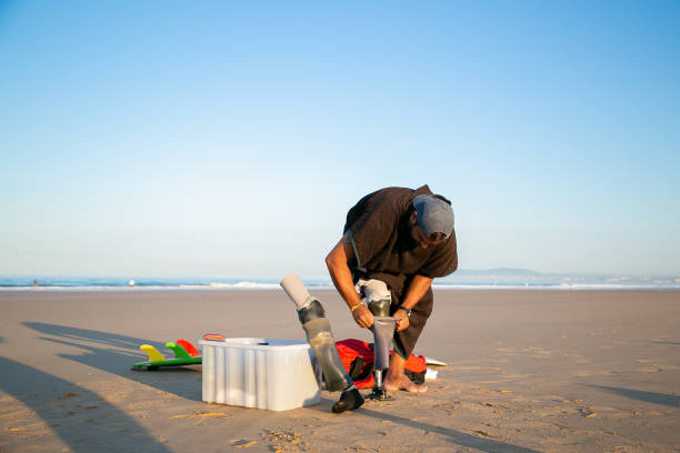 istock Young male surfer putting on rubber bandage 1289202614