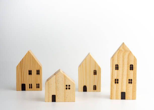 istock Wooden Miniature houses on white background. 1289203307