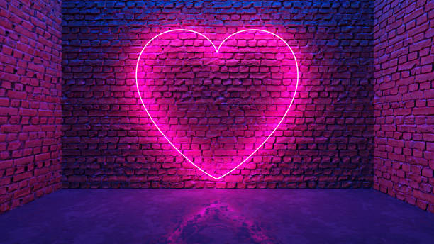 светящееся неоновое сердце в форме иконы на кирпичной стене в темной комнате - brick dancing стоковые фото и изображения