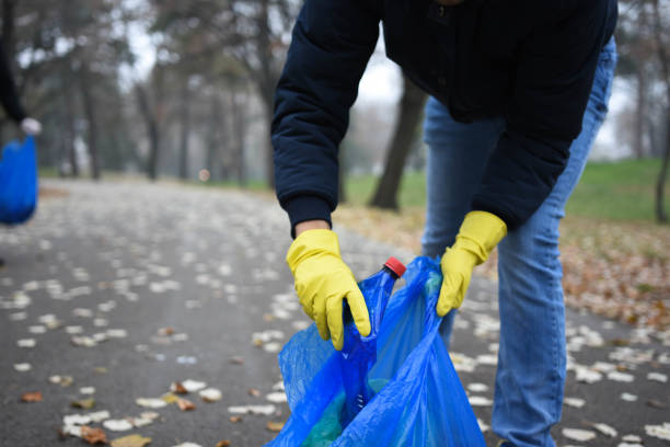 istock People collect garbage in the park. Close up 1289205019
