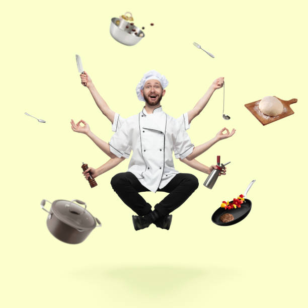istock Handsome multi-armed cooker levitating isolated on yellow studio background with equipment 1289205343