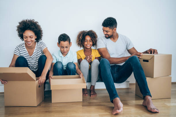 istock Young family moving in new home. 1289205370