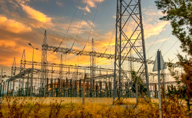 istock High voltage electricity pylons and transmission power lines 1289206230