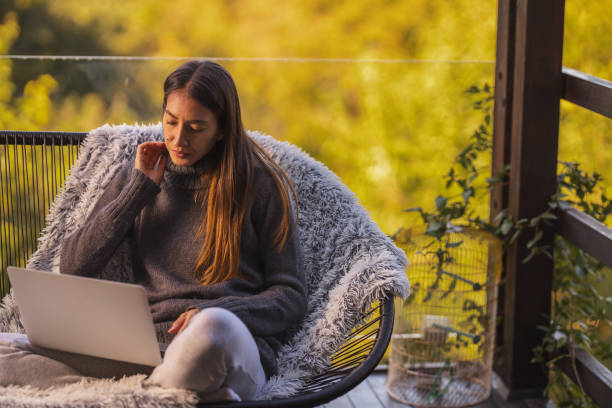 istock Young woman working from home 1289206412