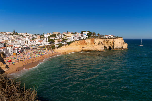View of the scenic Carvoeiro Beach (Praia do Carvoeiro) on a summer day, in Algarve Praia do Carvoeiro, Portugal - August 20, 2020: View of the scenic Carvoeiro Beach (Praia do Carvoeiro) on a summer day, in Algarve, Portugal beautiful beach in carvoeiro algarve portugal stock pictures, royalty-free photos & images
