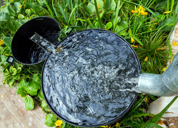 istock Two rainwater collection tanks with overflow 1289207895