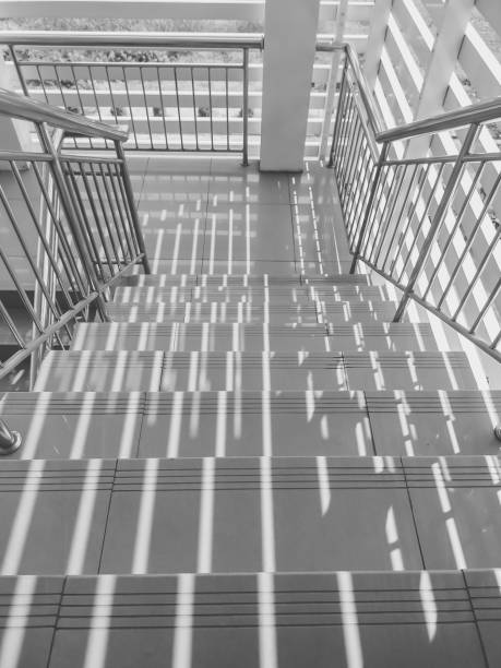istock Monochrome picture of stairs form high angle view 1289208788