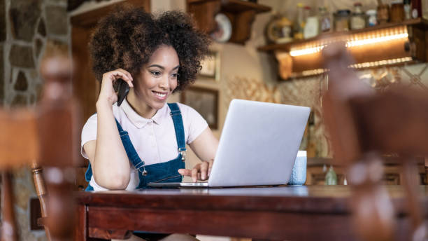 istock Afro women working from home in the kitchen, during COVID-19 1289210776