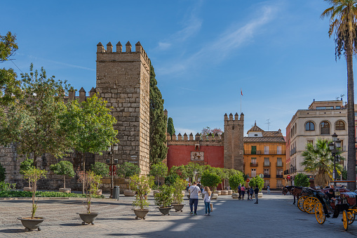 SEVILLE SPAIN, OCTOBER 18. 2020: Triumph Square, Plaza del Triunfo, with the Alcazar of Seville Reales