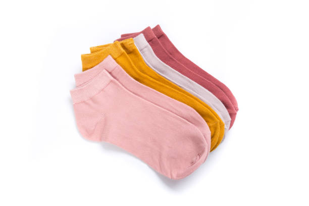 istock several Pairs of colored cheerful short socks on a white background, top view 1289213673