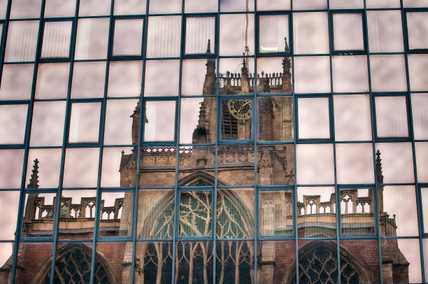 istock Holy Trinity Church reflected in glass office building windows, Hull, Humberside, England, Britain 1289213939