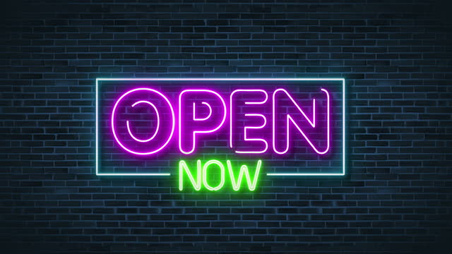 open now Neon Glowing Sign on brick wall.4K video