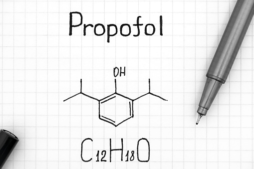 Chemical formula of Propofol with pen. Close-up.