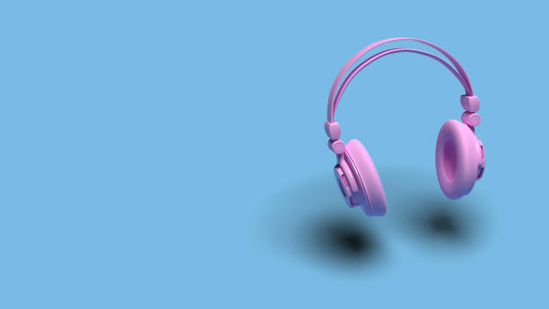 Music concept: A pink headphone against a blue background with shadow. Web banner size with copy space
