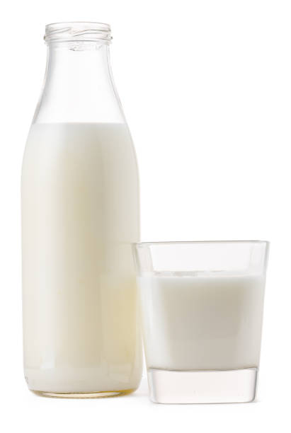 istock Glass cup and bottle of fresh milk isolated 1289215539