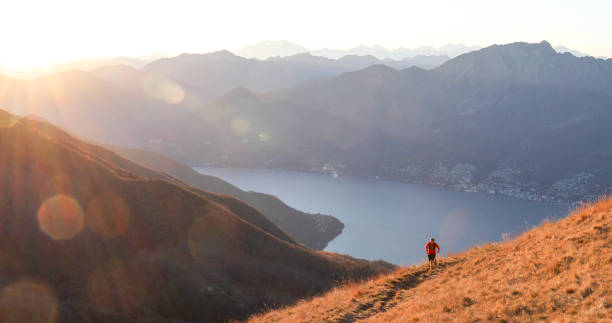 istock Trail runner crosses mountain ridge in the morning 1289215562