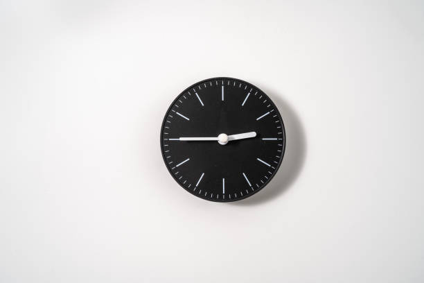 istock close up of an office clock on white background with clipping path 1289217201