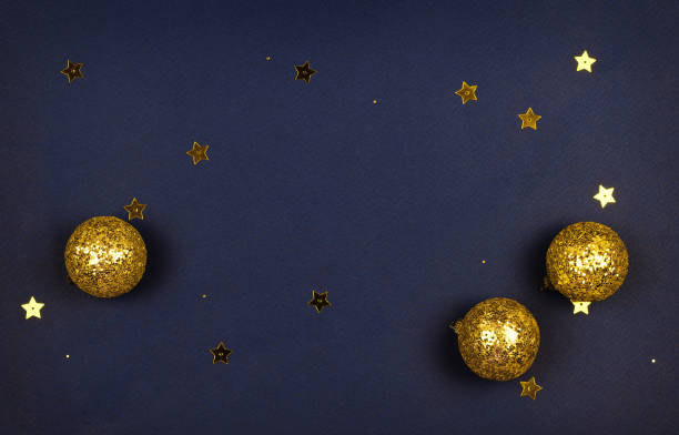 istock Golden Christmas decorations on dark blue paper 1289217206