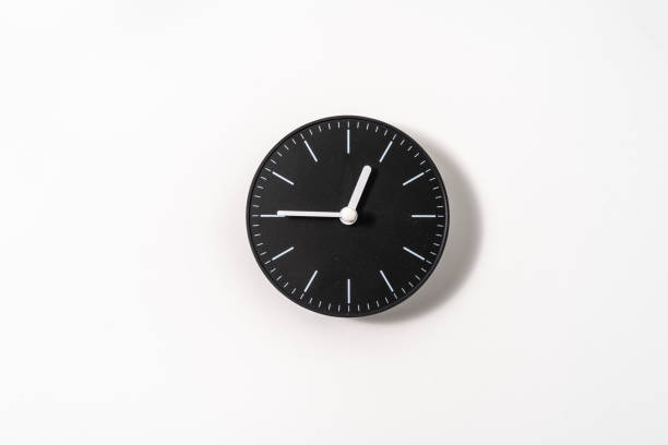 istock close up of an office clock on white background with clipping path 1289217239
