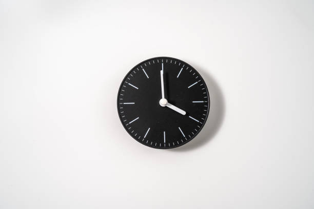 istock close up of an office clock on white background with clipping path 1289217316