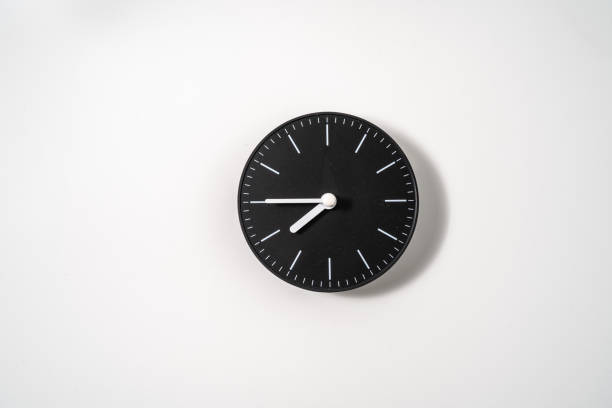 istock close up of an office clock on white background with clipping path 1289217768