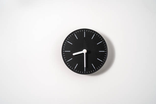 istock close up of an office clock on white background with clipping path 1289218767