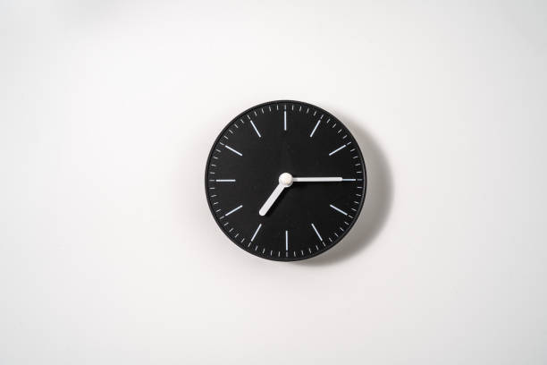istock close up of an office clock on white background with clipping path 1289218804