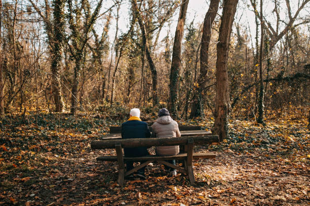istock Senior couple sitting on the bench 1289219552