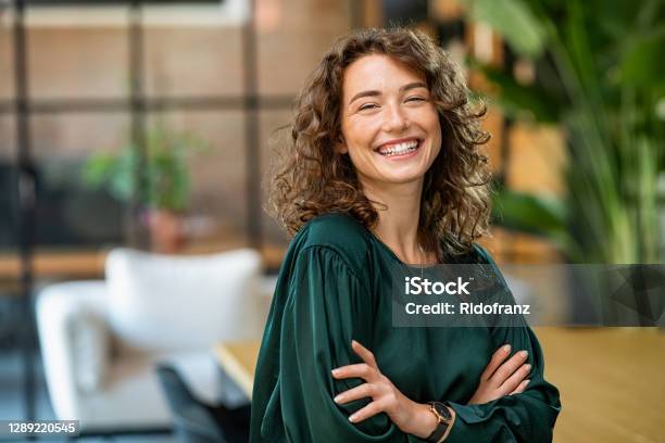 Beautiful Woman Smiling With Crossed Arms Stock Photo - Download Image Now - Women, One Woman Only, Happiness