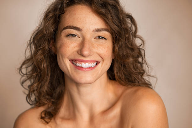 istock Beauty joyful young woman looking at camera 1289222321