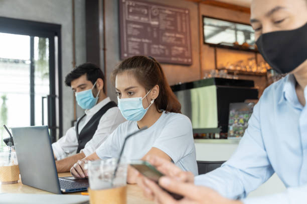 istock Asian people wearing mask working at coffee shop 1289222501