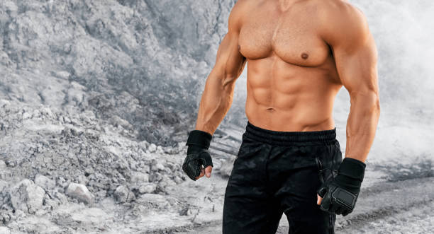istock Close up of young man with bare muscular torso 1289223364