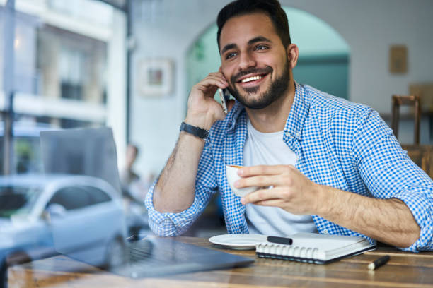 istock Cheerful man speaking on smartphone 1289223742