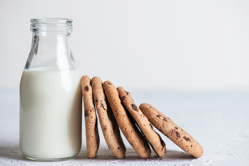 Cookies with a bottle of milk.