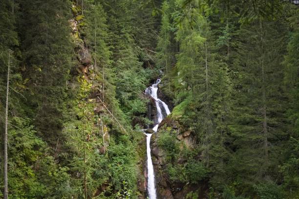 istock An isolated waterfall in the forest (Alps, Trentino, Italy) 1289225323