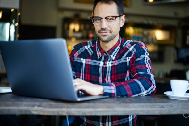 istock Positive man typing on laptop 1289226498