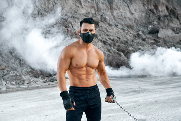 istock Fitness man in black mask doing sport activity on fresh air 1289227802