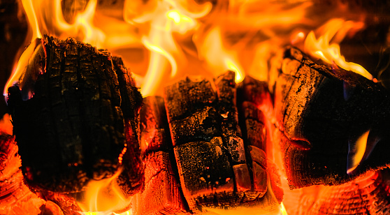 Close-up of well seasoned burning wood in a wood stove.