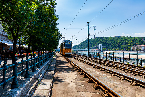Budapest, Hungary - Jun 1 2019: Tram line 2 running along the Danube with a beautiful setting -  it called the \
