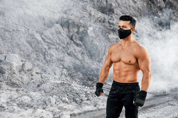 istock Strong and healthy guy relaxing during exercises outdoors 1289230544