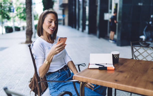 istock Relaxed millennial woman messaging on phone 1289230862