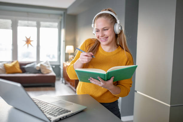 istock A young cheerful woman attends online classes 1289234523