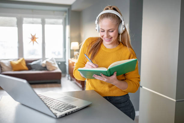 istock A young cheerful woman attends online classes 1289235526
