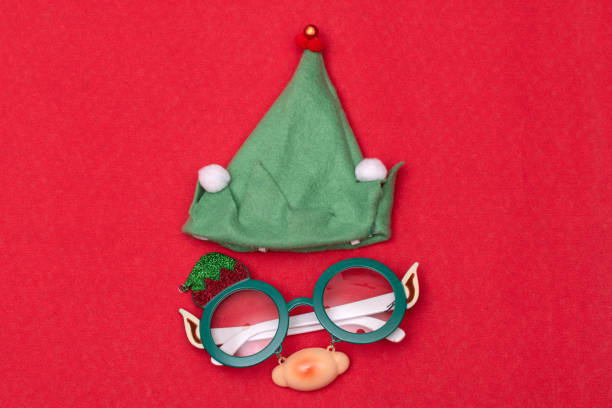 istock Elf hat and glasses, accessories for Christmas celebration 1289237331